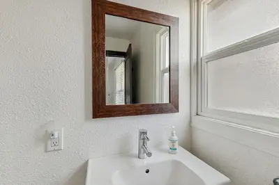 a bathroom with a sink and a mirror on the wall at Manzanita Holiday 2 in South Lake Tahoe