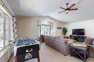 a living room with a foosball game on a table at Gold Dust Escape in South Lake Tahoe