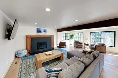 a living room with a couch and a fireplace at North Lake Adventure in Carnelian Bay