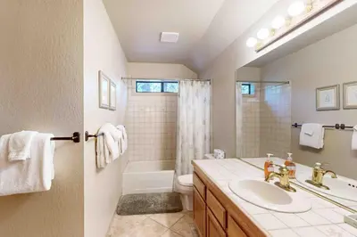 a bathroom with a sink and a toilet and a shower at Schussing Escape in Truckee