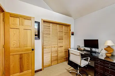 a room with a desk with a computer and a chair at Lausanne Getaway in Truckee