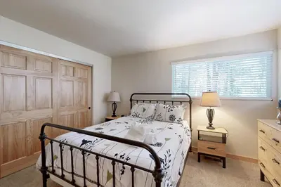 a bedroom with a bed and a window at Miztec Manor in South Lake Tahoe