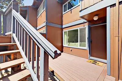 a wooden staircase leading to a building with a door at Ski Run Village in South Lake Tahoe