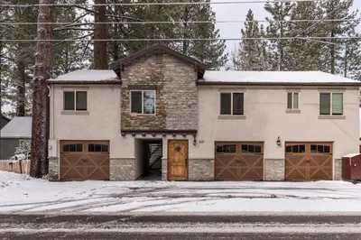 a house with two garage doors in the snow at Lakeview Manor in South Lake Tahoe
