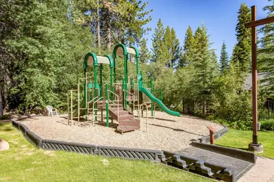 a playground with a slide in a park at Alpine Retreat in Truckee
