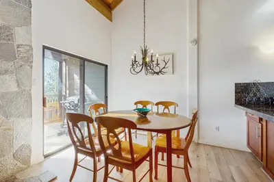 a dining room with a table and chairs at Alpine Retreat in Truckee