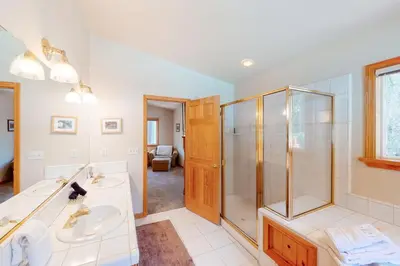 a bathroom with two sinks and a shower at Falcon Point Manor in Truckee