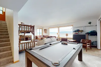 a living room with a pool table in it at Cascade Charms in South Lake Tahoe