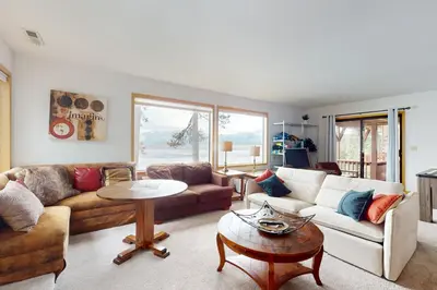 a living room with a couch and a table at Cascade Charms in South Lake Tahoe