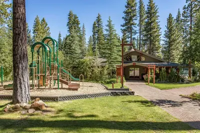 a playground in a park next to a building at Gold Bend Escape in Truckee