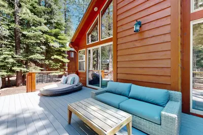 a porch with a couch and a bench on a house at Oslo Manor in Truckee
