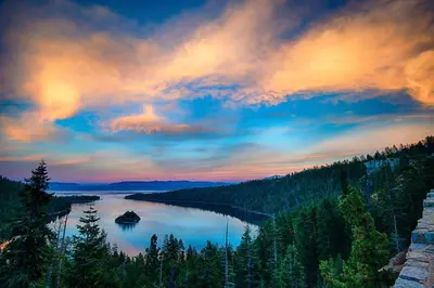 a view of a lake with trees and a cloudy sky at Sunlit Forest Haven in South Lake Tahoe