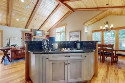 a kitchen with a counter top and a dining room at West Shore Retreat in Tahoma