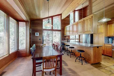 a large kitchen with a large wooden table and chairs at Amazing Dollar Point Retreat in Tahoe City