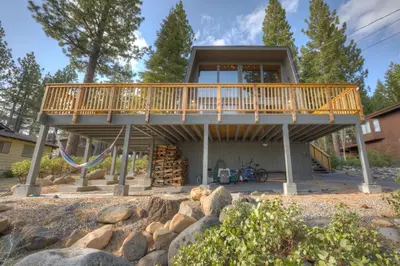 a house with a deck over a playground at Dollar Point in Tahoe City
