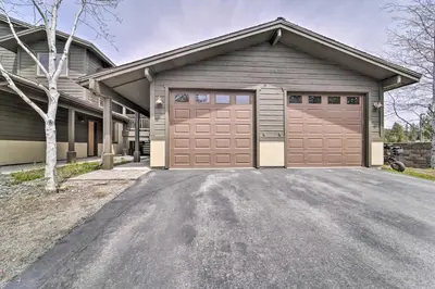 a house with two garage doors on a driveway at 2 Mi to Donner Lake Walkable Truckee Condo! in Truckee