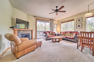 a living room with couches and a fireplace at 2 Mi to Donner Lake Walkable Truckee Condo! in Truckee