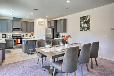 a kitchen and dining room with a table and chairs at Sacramento Retreat with Yard about 13 Mi to Dtwn! in Elk Grove