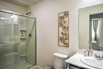 a bathroom with a shower and a toilet and a sink at Sacramento Retreat with Yard about 13 Mi to Dtwn! in Elk Grove