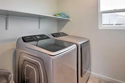 a washer and dryer in a small room at Sacramento Retreat with Yard about 13 Mi to Dtwn! in Elk Grove