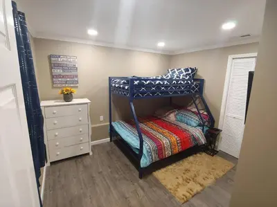 a small bedroom with a bunk bed and a dresser at Mountain Cabin near Yosemite in Groveland