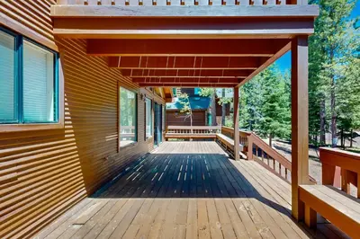a wooden deck on the side of a house at Snowpeak Oasis in Truckee