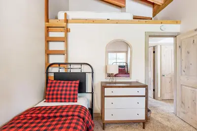 a bedroom with a bunk bed and a dresser at Gold Bend Adventure in Truckee