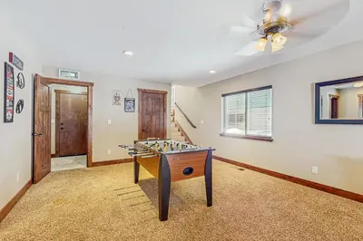 a room with a game table in the middle of it at Miztec Charms in South Lake Tahoe