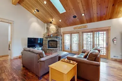 a living room with two couches and a fireplace at High Meadows Gem in South Lake Tahoe