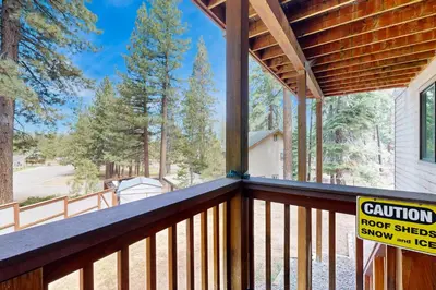 a balcony with a roof with a sign on it at High Meadows Gem in South Lake Tahoe