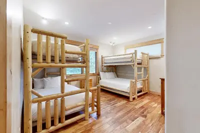 a room with three bunk beds in a house at High Meadows Gem in South Lake Tahoe