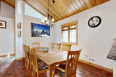 a dining room with a wooden table and chairs at High Meadows Gem in South Lake Tahoe