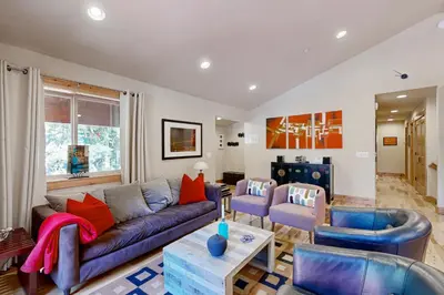 a living room with a couch and chairs at Oslo Oasis in Truckee