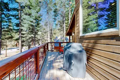 a porch of a house with a backpack on it at Oslo Oasis in Truckee