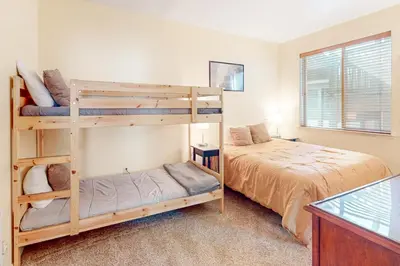 a bedroom with two bunk beds and a bed at The Boulders Bldg 2 Unit 3 in Truckee