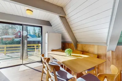 a kitchen and dining room with a table and chairs at Arrowhead Escape in South Lake Tahoe