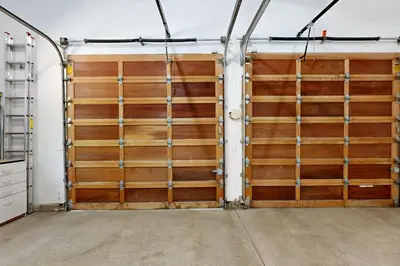 a garage with two wooden doors in a room at Tyrol Getaway in Truckee