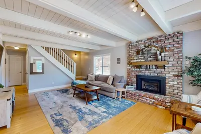 a living room with a couch and a fireplace at Cougar Haven in South Lake Tahoe