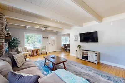 a living room with a couch and a table at Cougar Haven in South Lake Tahoe