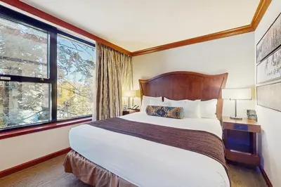 a hotel room with a bed and a window at Resort at Squaw Creek's 560 & 558 in Olympic Valley