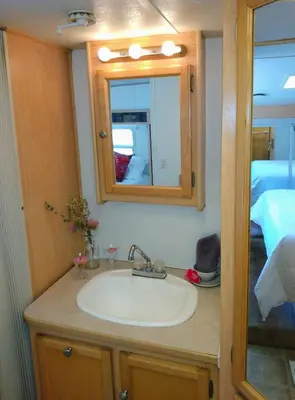 a bathroom with a sink and a mirror at Quiet Mind Lodge, Spa & Retreat Sequoias in Kernville