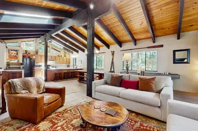 a living room with a couch and a table at Simplon Pass Escape in Homewood