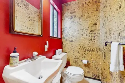 a bathroom with a white sink and a toilet at Simplon Pass Escape in Homewood