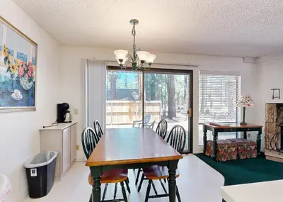 a dining room with a table and chairs and a window at The Summit E3 in South Lake Tahoe
