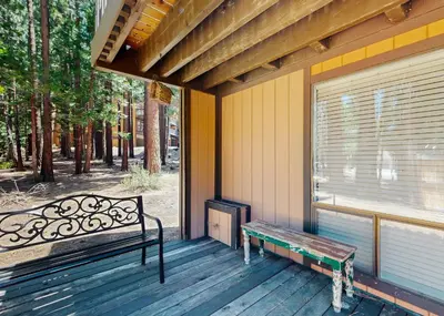 a bench sitting on the porch of a house at The Summit E3 in South Lake Tahoe
