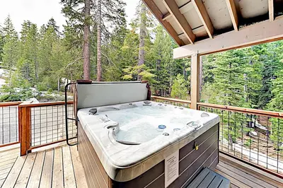 a hot tub on the deck of a house at Pooewin Place in South Lake Tahoe