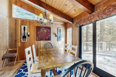 a dining room with a wooden table and chairs at Northstar Home in Truckee