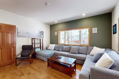 a living room with a couch and a table at High Meadow Storybook in South Lake Tahoe