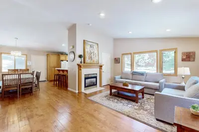 a living room with a couch and a fireplace at High Meadow Storybook in South Lake Tahoe