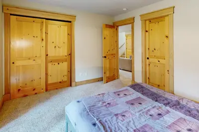 a bedroom with wooden cabinets and a bed at Charles Charmer in South Lake Tahoe